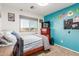 Vibrant bedroom with painted accent wall, window views, carpet flooring, and closet space at 3848 S Coach House Dr, Gilbert, AZ 85297