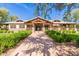 Community clubhouse with shaded walkways and ample greenery for outdoor enjoyment at 3848 S Coach House Dr, Gilbert, AZ 85297