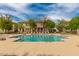 Community pool with lounge chairs, surrounded by trees and residential buildings at 3848 S Coach House Dr, Gilbert, AZ 85297