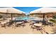 Community pool featuring lounge seating, tables and fun water features at 3848 S Coach House Dr, Gilbert, AZ 85297