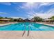 Relaxing community pool with clear blue water, lane markers, and pool-side seating at 3848 S Coach House Dr, Gilbert, AZ 85297
