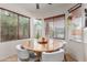 Bright dining area featuring large windows and a round dining table at 3848 S Coach House Dr, Gilbert, AZ 85297
