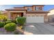 Charming two-story home featuring a stucco exterior, tile roof, and well-maintained landscaping at 3848 S Coach House Dr, Gilbert, AZ 85297