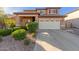 Charming two-story home featuring a stucco exterior, tile roof, and well-maintained landscaping at 3848 S Coach House Dr, Gilbert, AZ 85297