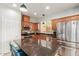 Well-lit kitchen with stainless steel appliances and dark granite countertops at 3848 S Coach House Dr, Gilbert, AZ 85297
