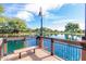 Relax on the lake deck with a bench, overlooking the calm water and sky at 3848 S Coach House Dr, Gilbert, AZ 85297