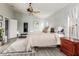 Bright bedroom with a vaulted ceiling, brick accent wall, and neutral decor at 3848 S Coach House Dr, Gilbert, AZ 85297