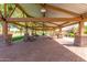 Community pavilion featuring picnic tables and shade, perfect for outdoor events and gatherings at 3848 S Coach House Dr, Gilbert, AZ 85297