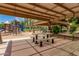 Playground and picnic benches under a shaded structure in a community park at 3848 S Coach House Dr, Gilbert, AZ 85297