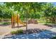 Vibrant playground with colorful play structures, safe surfacing, and shady trees at 3848 S Coach House Dr, Gilbert, AZ 85297