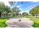 Community splash pad with whimsical water features and soft turf surroundings at 3848 S Coach House Dr, Gilbert, AZ 85297