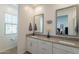 This bathroom is designed with dual sinks, a vanity, and is adjacent to a toilet room enhancing privacy and convenience at 4077 S Sabrina Dr # 25, Chandler, AZ 85248