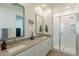 This modern bathroom features double sinks, a pristine white shower, and elegant fixtures for a spa-like experience at 4077 S Sabrina Dr # 25, Chandler, AZ 85248