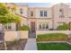 Beautiful townhome exterior with manicured lawn, a gated courtyard and a charming walkway at 4077 S Sabrina Dr # 25, Chandler, AZ 85248