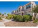 Inviting two-story home featuring a landscaped front yard and charming architectural details under a clear blue sky at 4077 S Sabrina Dr # 25, Chandler, AZ 85248