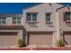 Charming townhome featuring a two-car garage and neutral-colored stucco exterior at 4077 S Sabrina Dr # 25, Chandler, AZ 85248