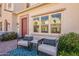 Inviting front porch with stylish seating and a view of the townhome's charming facade at 4077 S Sabrina Dr # 25, Chandler, AZ 85248