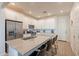 Modern kitchen with stainless steel appliances, white cabinetry, and an island with bar seating at 4077 S Sabrina Dr # 25, Chandler, AZ 85248