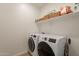 Clean, functional laundry room equipped with modern washer and dryer at 4077 S Sabrina Dr # 25, Chandler, AZ 85248
