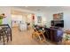 Open-concept living room with modern decor, leading into a bright, white kitchen at 4077 S Sabrina Dr # 25, Chandler, AZ 85248
