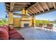 Inviting covered patio with a fireplace, tiled floor, and comfortable seating, perfect for outdoor relaxation and entertaining at 4077 S Sabrina Dr # 25, Chandler, AZ 85248