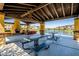 Community pavilion with picnic tables, fireplace, and views of the lake and water fountain at 4077 S Sabrina Dr # 25, Chandler, AZ 85248