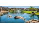 Scenic pond featuring a fountain, grassy shoreline, and rock detail at 4077 S Sabrina Dr # 25, Chandler, AZ 85248