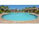 Community pool featuring clear blue water and a covered ramada with seating at 4077 S Sabrina Dr # 25, Chandler, AZ 85248