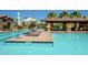 Community pool and sun deck featuring multiple lounge chairs and umbrellas at 4077 S Sabrina Dr # 25, Chandler, AZ 85248