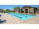 Community pool featuring a bath house, clear blue water, and well-maintained landscaping at 4077 S Sabrina Dr # 25, Chandler, AZ 85248