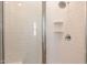 The modern walk-in shower features a glass door, white tiled walls, and a sleek shower head for a spa experience at 4077 S Sabrina Dr # 25, Chandler, AZ 85248