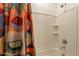 Close-up of shower with white tile and colorful curtain at 4077 S Sabrina Dr # 25, Chandler, AZ 85248