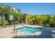 Community spa surrounded by lush landscaping and a black fence at 4077 S Sabrina Dr # 25, Chandler, AZ 85248