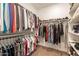 Organized walk-in closet with ample hanging space and shelving for shoes, clothing, and accessories at 4077 S Sabrina Dr # 25, Chandler, AZ 85248