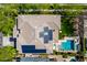 Aerial view of a beautiful home featuring a private pool, outdoor seating, and solar panels on the roof at 4167 E Sierra Madre Ave, Gilbert, AZ 85296