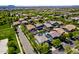 Desirable neighborhood aerial featuring tree-lined streets, community park, and inviting homes with pools at 4167 E Sierra Madre Ave, Gilbert, AZ 85296
