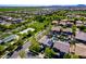 Serene aerial view showcases lush neighborhood with park, green spaces, and well-maintained homes at 4167 E Sierra Madre Ave, Gilbert, AZ 85296