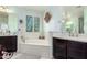 Luxurious bathroom featuring a large soaking tub, dual vanities, and plenty of natural light at 4167 E Sierra Madre Ave, Gilbert, AZ 85296