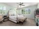 Tranquil bedroom with a four-poster bed, soft colors, and natural light streaming through plantation shutters at 4167 E Sierra Madre Ave, Gilbert, AZ 85296