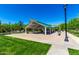 Community pavilion for outdoor dining and relaxation surrounded by walking paths and trees at 4167 E Sierra Madre Ave, Gilbert, AZ 85296