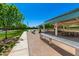 Community pavilion with picnic tables and benches, perfect for gatherings and outdoor dining at 4167 E Sierra Madre Ave, Gilbert, AZ 85296
