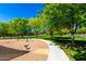 Community playground with swings, play structures, and green spaces for outdoor recreation at 4167 E Sierra Madre Ave, Gilbert, AZ 85296