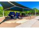 Community playground featuring a covered play structure with slides and climbing features for enjoyment at 4167 E Sierra Madre Ave, Gilbert, AZ 85296