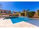 Inviting pool area with beautiful tile work, comfortable lounge seating, and well-maintained landscaping at 4167 E Sierra Madre Ave, Gilbert, AZ 85296