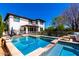 Sparkling pool and spa surrounded by travertine tile, perfect for relaxation and entertaining at 4167 E Sierra Madre Ave, Gilbert, AZ 85296