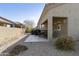 Covered patio with furniture, rock landscaping and stucco wall in backyard at 4202 E Broadway Rd # 126, Mesa, AZ 85206