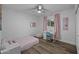 A bedroom that has a bed, a desk, and a window with pink curtains at 4228 N 87Th St, Scottsdale, AZ 85251
