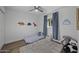 bedroom featuring hardwood floors, ceiling fan, and dinosaur wall decor at 4228 N 87Th St, Scottsdale, AZ 85251