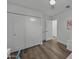 Bright bedroom featuring hardwood floors, ceiling fan, and ample closet space at 4228 N 87Th St, Scottsdale, AZ 85251