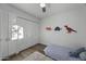 Well-lit bedroom features hardwood floors, ceiling fan, and ample closet space at 4228 N 87Th St, Scottsdale, AZ 85251